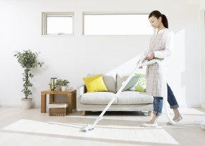woman vacuuming floor
